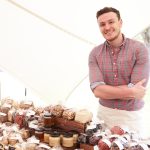 Stall Holder At Farmers Food Market Selling Nuts And Seeds