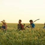 workers-walking-in-rye-field.jpg